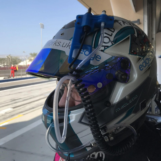 Race car drink system on helmet
